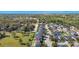 Aerial view of a residential neighborhood showcasing landscaped yards and mature trees at 137 Kays Landing Dr, Sanford, FL 32771