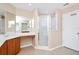 Bathroom showcasing glass enclosed shower, dual vanities, and tile flooring at 137 Kays Landing Dr, Sanford, FL 32771