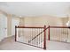 Hallway featuring neutral carpeting and wooden railings at 137 Kays Landing Dr, Sanford, FL 32771