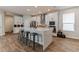 Modern kitchen featuring a large center island, stainless steel appliances, and white cabinetry at 13819 Lanyard Way, Winter Garden, FL 34787