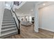 Open concept living space with stairs, wood floors, and view of the living room and kitchen at 13819 Lanyard Way, Winter Garden, FL 34787