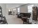 Large loft space with multiple gaming setups, cozy seating, and ample room for recreation at 13819 Lanyard Way, Winter Garden, FL 34787