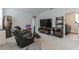 Upstairs loft space with a gaming setup, comfortable seating, and plenty of room for entertainment at 13819 Lanyard Way, Winter Garden, FL 34787