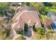 Sprawling property showcasing the red tile roof, screened pool, and well-manicured grounds at 1502 Hempel Ave, Windermere, FL 34786