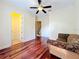 Spacious bedroom with hardwood flooring and access to the stairs at 1502 Hempel Ave, Windermere, FL 34786