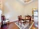 Formal dining area featuring hardwood floors, decorative rug, elegant chandelier, and room for four at 1502 Hempel Ave, Windermere, FL 34786