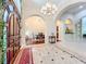 Elegant foyer with tile flooring, arched openings, and a view into the dining area at 1502 Hempel Ave, Windermere, FL 34786