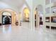 Elegant foyer with arched doorways and plenty of natural light at 1502 Hempel Ave, Windermere, FL 34786