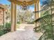 Covered entryway with columns, tiled floor, and a picturesque view of the front yard at 1502 Hempel Ave, Windermere, FL 34786