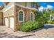 Exterior view showcasing the garage, stone accents, and well-maintained landscaping at 1502 Hempel Ave, Windermere, FL 34786