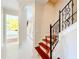 Bright hallway features tiled floors and an archway leading to another area of the home at 1502 Hempel Ave, Windermere, FL 34786