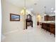 Living area view shows a fireplace, mantle mirror, and access to the kitchen at 1502 Hempel Ave, Windermere, FL 34786