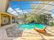 Outdoor living space with a screened pool and patio for relaxation and entertainment at 1502 Hempel Ave, Windermere, FL 34786