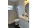 Modern bathroom features a beautiful vanity, elegant fixtures, and a tiled shower at 15081 Sw 35Th Cir, Ocala, FL 34473