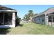 Manicured front lawn and exteriors of two homes at 1746 Golfview Drive, Kissimmee, FL 34746