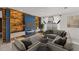 Inviting living room with a modern fireplace, unique wood-paneled wall, and stylish furnishings at 1751 Sereno Dr, Davenport, FL 33896