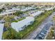 Aerial view featuring the building's exterior, landscaping, and parking lot at 1897 Caralee Blvd # 2, Orlando, FL 32822