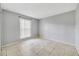 This bedroom has neutral paint, tile floor, and a window at 1897 Caralee Blvd # 2, Orlando, FL 32822