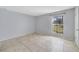 Bedroom with tile floors and natural light from window at 1897 Caralee Blvd # 2, Orlando, FL 32822