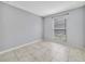 This bedroom has neutral paint, tile floor, and a window at 1897 Caralee Blvd # 2, Orlando, FL 32822