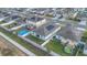 Aerial shot of fenced backyards with lawns, patios, and above-ground pools at 1934 Pond Pine Ct, Haines City, FL 33844