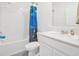 Well-lit bathroom with shower/tub combination, white vanity and bright lighting at 1934 Pond Pine Ct, Haines City, FL 33844