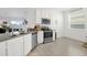 Modern kitchen featuring stainless steel appliances, ample counter space, and tile flooring at 1934 Pond Pine Ct, Haines City, FL 33844