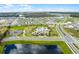 Overhead view of a Gathering-friendly community with a central pool, clubhouse, and abundant green spaces at 1982 Cricket Cradle Dr, Kissimmee, FL 34746