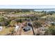 Aerial view of property showcasing landscape with beautiful trees and neighboring homes with property outline at 204 Brooks Rd, Frostproof, FL 33843
