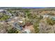 Aerial view of a wooded residential area with lakes visible in the background, a serene retreat at 204 Brooks Rd, Frostproof, FL 33843