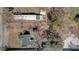 Birds eye aerial view of property showcasing landscaping and multiple structures on the lot at 204 Brooks Rd, Frostproof, FL 33843