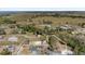 Aerial view of property showcasing rural landscape with beautiful trees and neighboring homes with property outline at 204 Brooks Rd, Frostproof, FL 33843