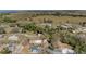 Expansive aerial view of property showcasing rural landscape with beautiful trees and neighboring homes at 204 Brooks Rd, Frostproof, FL 33843