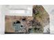 Birds eye aerial view of property showcasing landscaping and multiple structures on the lot with property outline at 204 Brooks Rd, Frostproof, FL 33843