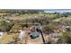 Aerial view of a property showcasing its layout, including the buildings, trees, and the surrounding landscape at 204 Brooks Rd, Frostproof, FL 33843