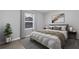 Comfortable bedroom with a queen-size bed, soft lighting, and a calming color scheme at 204 Brooks Rd, Frostproof, FL 33843