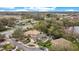 Aerial view of the home featuring landscaping, a paver driveway, blue pool and nearby lake at 210 Laurel Park Ct, Winter Park, FL 32792