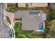 An aerial view of a home featuring solar panels, a pool, and a well-maintained landscape at 210 Laurel Park Ct, Winter Park, FL 32792