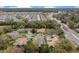 An aerial view of the home featuring an abundance of mature landscaping and a paver driveway at 210 Laurel Park Ct, Winter Park, FL 32792