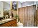 Traditional bathroom with vanity sink, marble countertop, and decorative shower curtain at 210 Laurel Park Ct, Winter Park, FL 32792