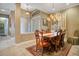 Formal dining room with chandelier lighting and classic wood table and chairs at 210 Laurel Park Ct, Winter Park, FL 32792