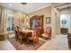 Traditional dining room showcasing an elegant china cabinet and seating for six at 210 Laurel Park Ct, Winter Park, FL 32792