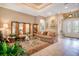 Elegant living room features a decorative screen, stylish furniture, and neutral tones at 210 Laurel Park Ct, Winter Park, FL 32792