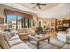 Bright living room boasts large windows, neutral decor, and an open floor plan at 210 Laurel Park Ct, Winter Park, FL 32792