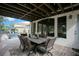 Inviting covered patio with dining area, perfect for outdoor gatherings with a view of the pool at 210 Laurel Park Ct, Winter Park, FL 32792