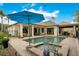 The pool has bar stools in the water and access to both an open patio and covered patio at 210 Laurel Park Ct, Winter Park, FL 32792