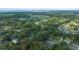 High angle shot of a tree-lined residential neighborhood near a large lake at 212 Glenn St, Leesburg, FL 34748