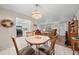 Comfortable dining area with connections to the kitchen and main living area at 212 Glenn St, Leesburg, FL 34748