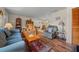 Comfortable living room with hardwood floors and a view into the dining area at 212 Glenn St, Leesburg, FL 34748