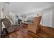 Inviting living room with lots of natural light and hardwood flooring at 212 Glenn St, Leesburg, FL 34748